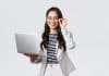O que montar com R$ 25 mil? Business, finance and employment, female successful entrepreneurs concept. Confident smiling asian businesswoman, office worker in white suit and glasses using laptop, help clients