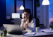 Business woman looking at professional laptop working at marketing graphs project